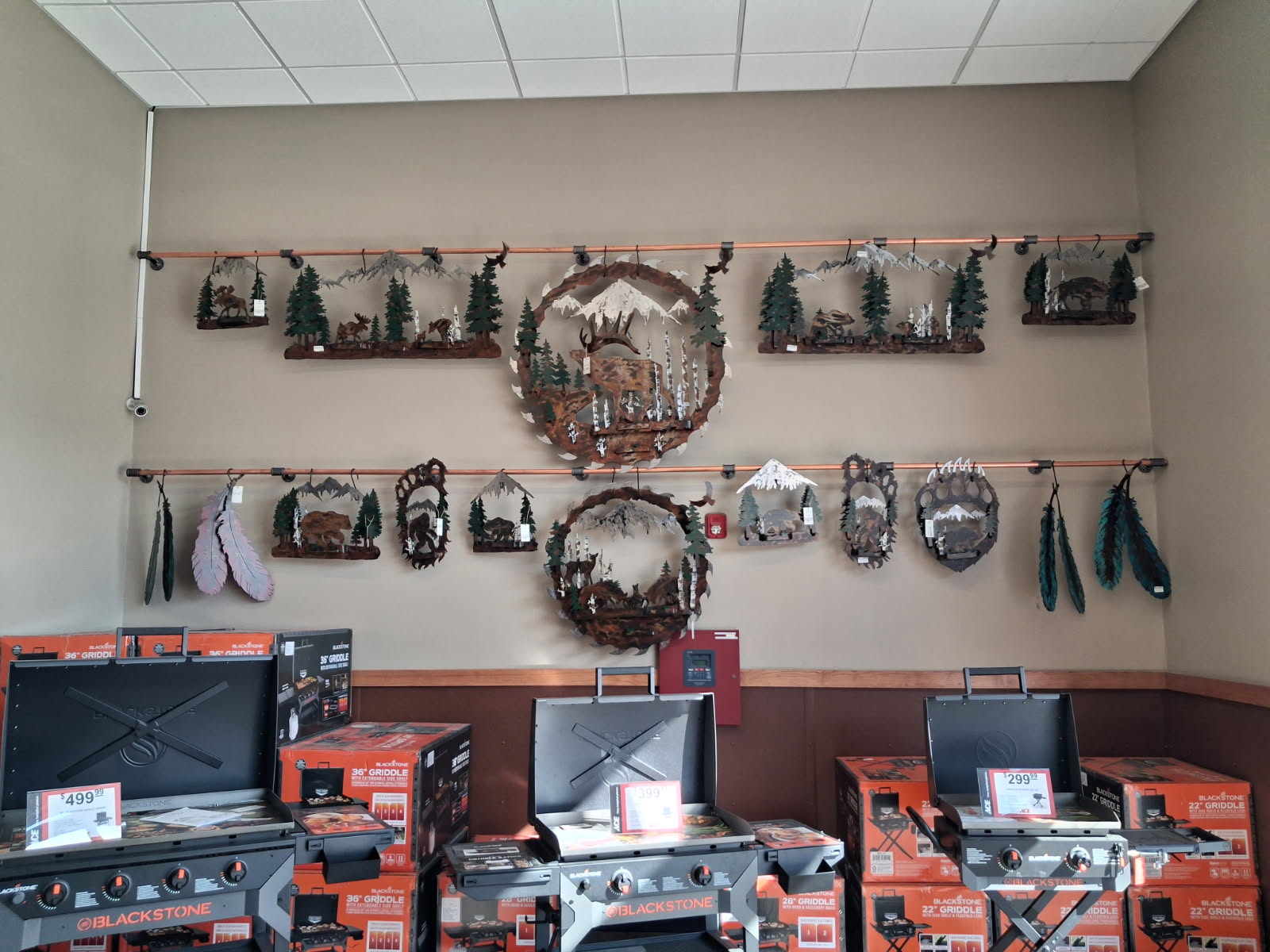 Rusted Metal Works pieces displayed at Ace Hardware